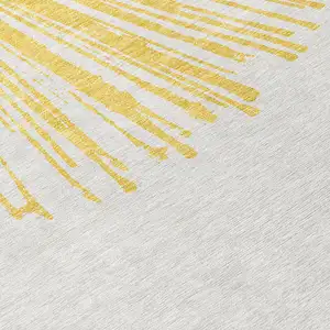 Photo of Gold And Ivory Abstract Washable Indoor Outdoor Area Rug