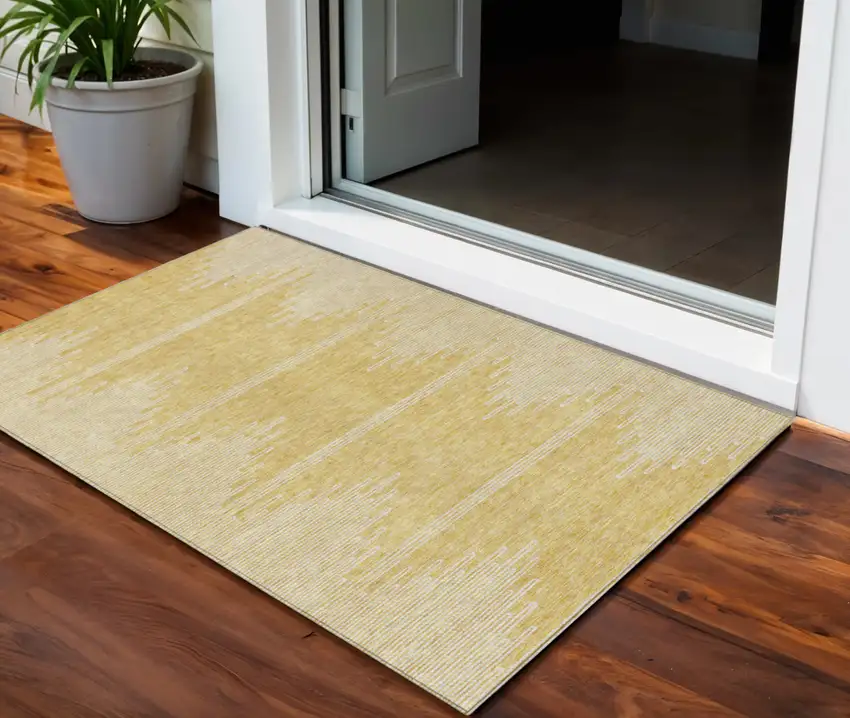 Gold And Ivory Abstract Washable Indoor Outdoor Area Rug Photo 1