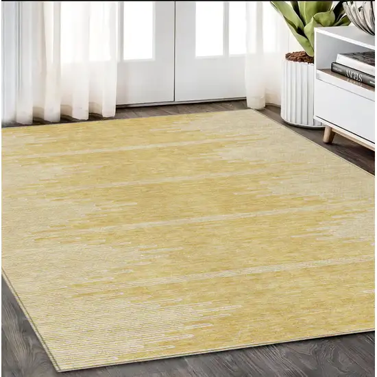 Gold And Ivory Abstract Washable Indoor Outdoor Area Rug Photo 8