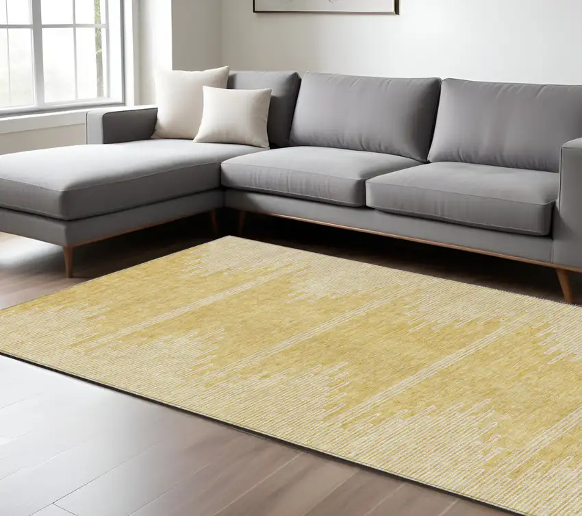 Gold And Ivory Abstract Washable Indoor Outdoor Area Rug Photo 9