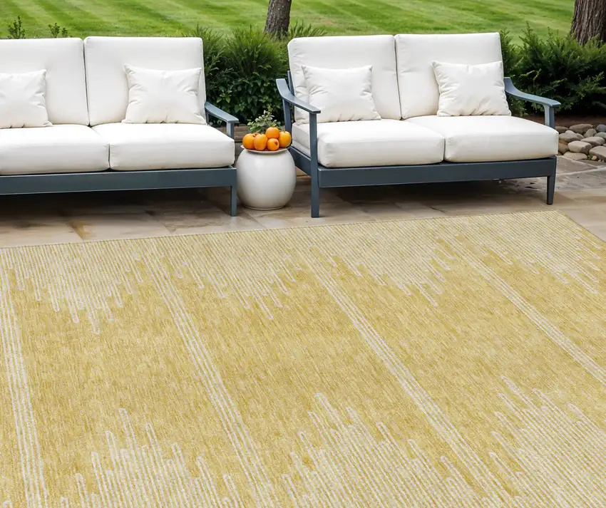 Gold And Ivory Abstract Washable Indoor Outdoor Area Rug Photo 1