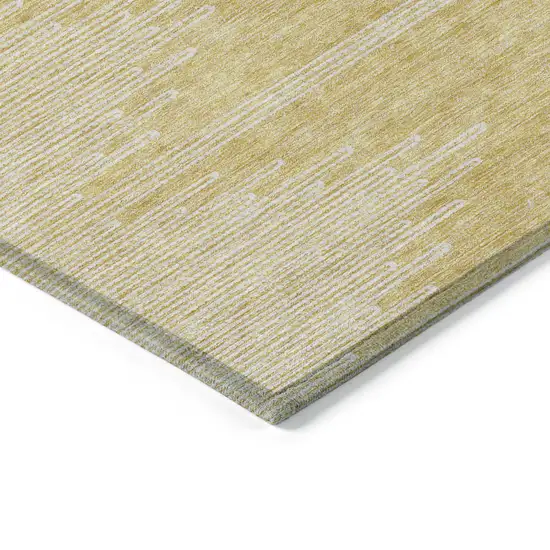 Gold And Ivory Abstract Washable Indoor Outdoor Area Rug Photo 6