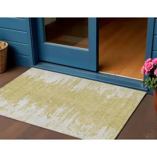 Gold And Ivory Abstract Washable Indoor Outdoor Area Rug Photo 1