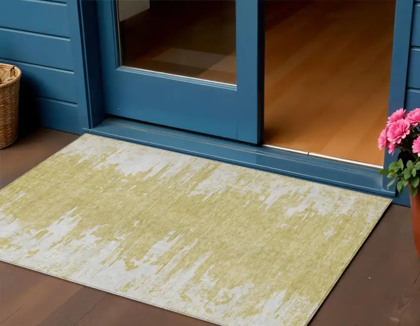 Gold And Ivory Abstract Washable Indoor Outdoor Area Rug Photo 1