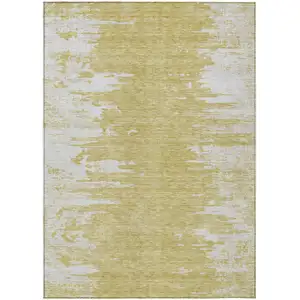 Photo of Gold And Ivory Abstract Washable Indoor Outdoor Area Rug