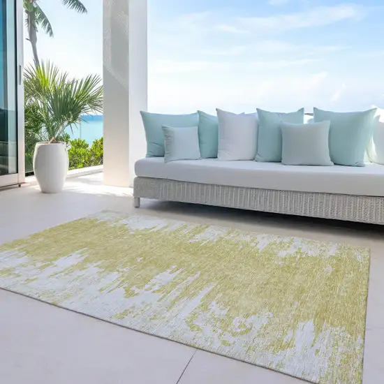 Gold And Ivory Abstract Washable Indoor Outdoor Area Rug Photo 9