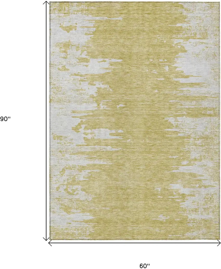 Gold And Ivory Abstract Washable Indoor Outdoor Area Rug Photo 3