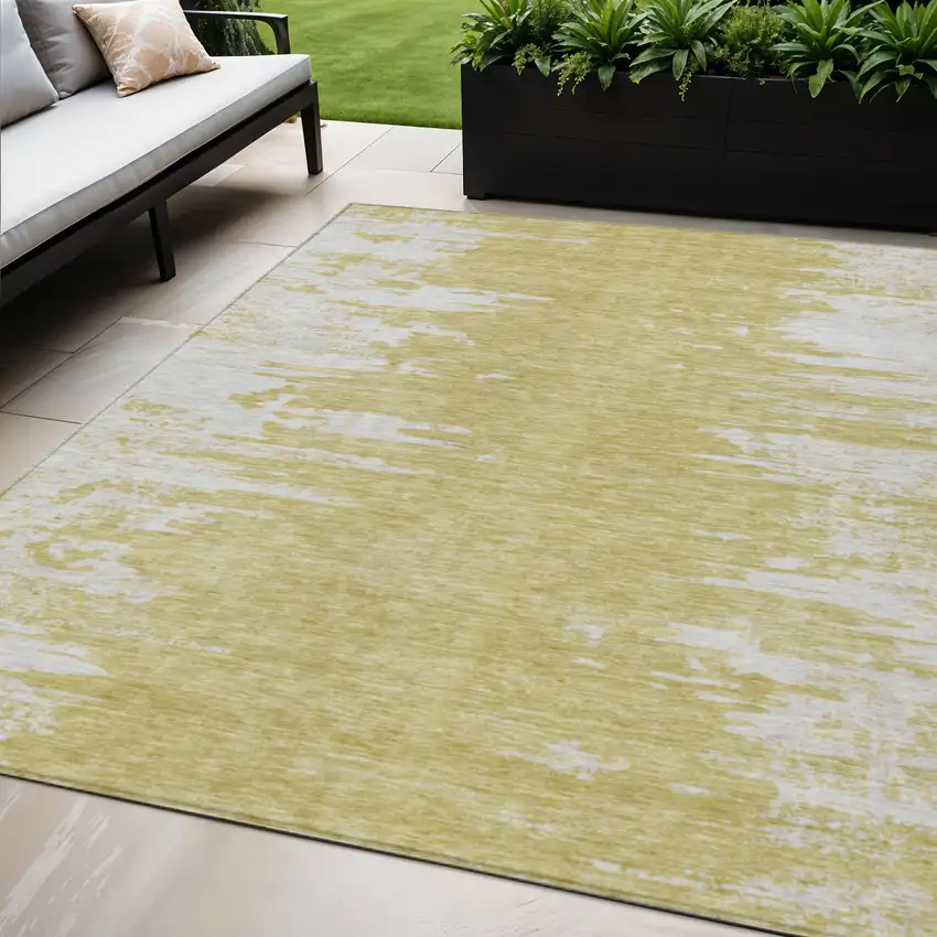 Gold And Ivory Abstract Washable Indoor Outdoor Area Rug Photo 1