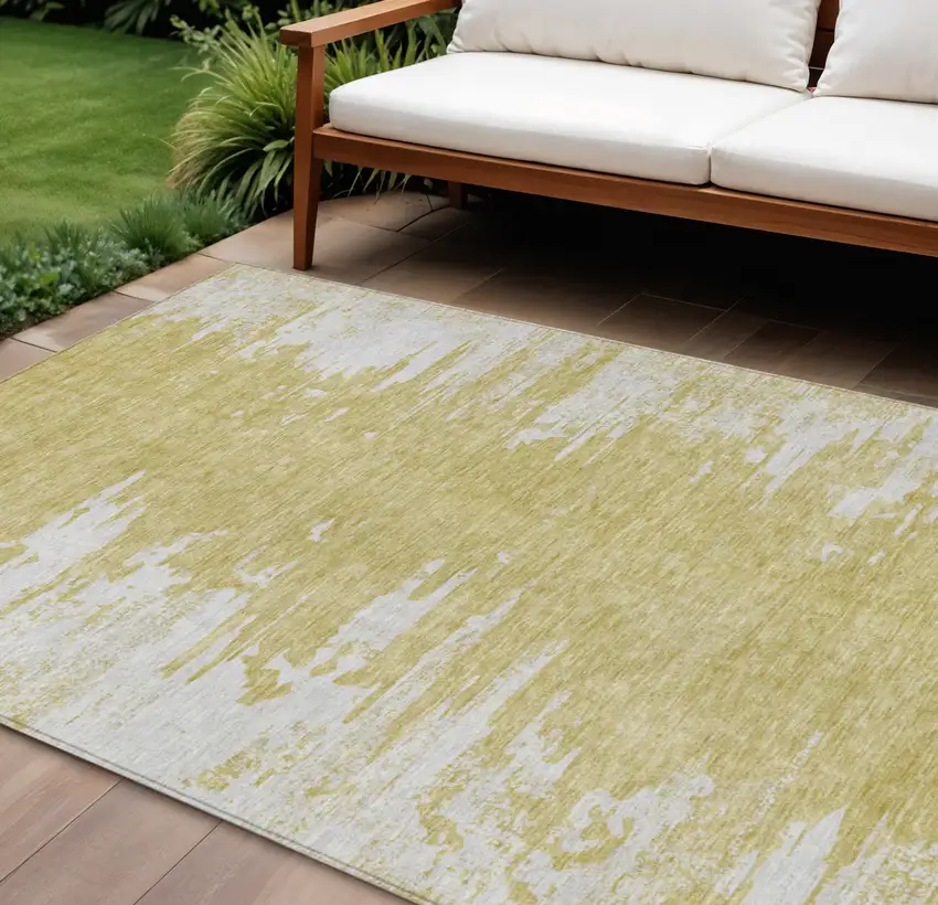Gold And Ivory Abstract Washable Indoor Outdoor Area Rug Photo 1