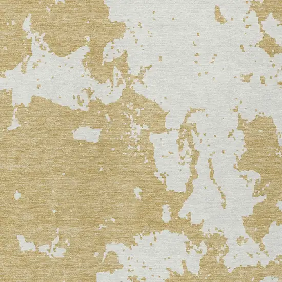 Gold And Ivory Abstract Washable Indoor Outdoor Area Rug Photo 6