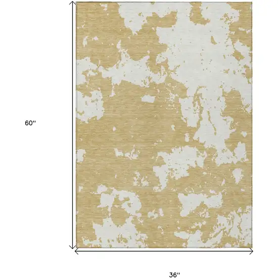 Gold And Ivory Abstract Washable Indoor Outdoor Area Rug Photo 3