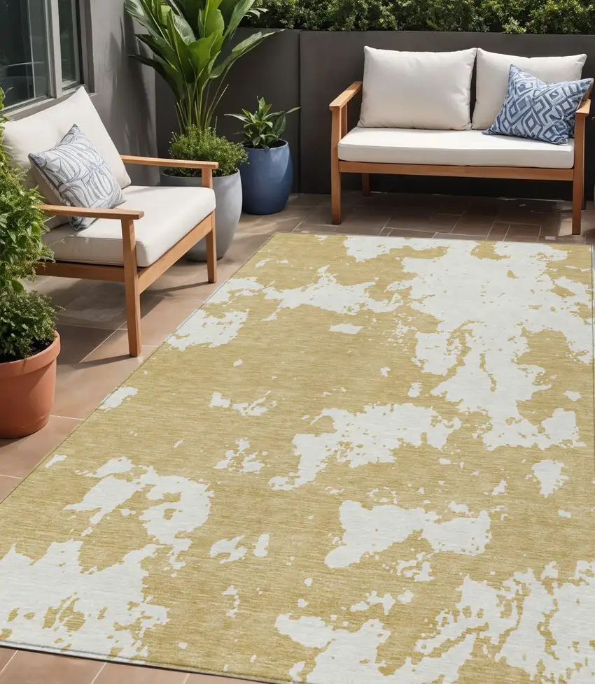 Gold And Ivory Abstract Washable Indoor Outdoor Area Rug Photo 1