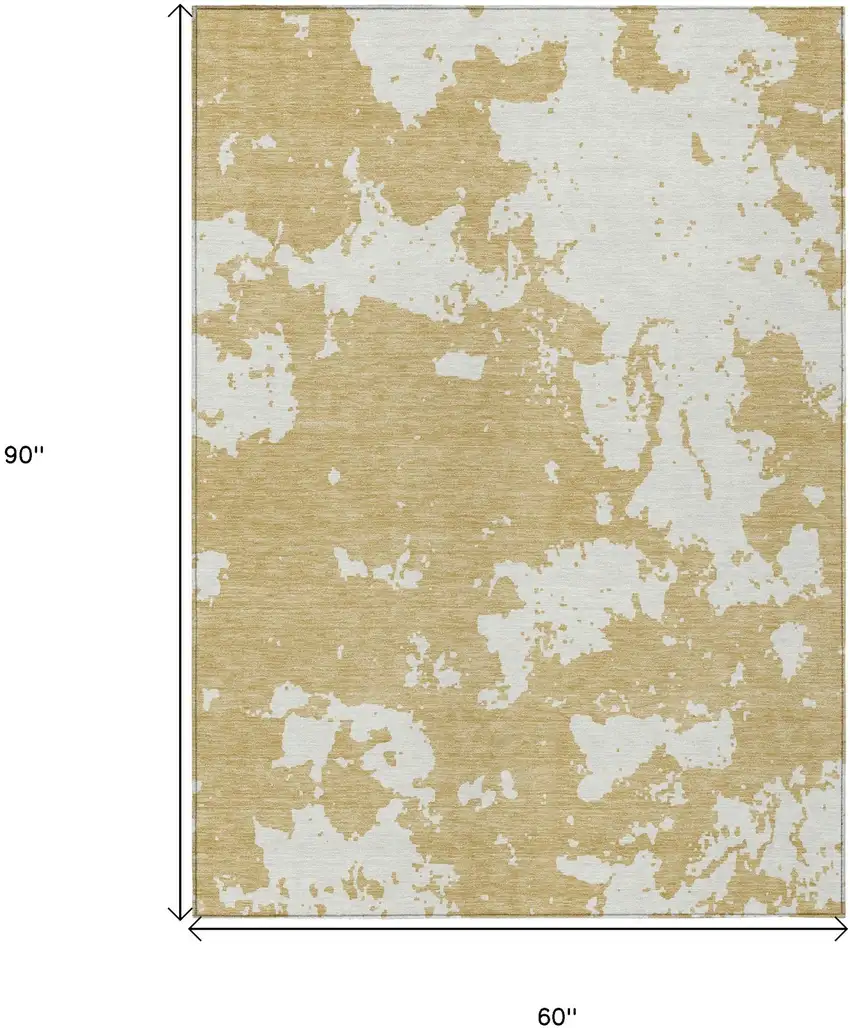Gold And Ivory Abstract Washable Indoor Outdoor Area Rug Photo 3