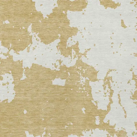 Gold And Ivory Abstract Washable Indoor Outdoor Area Rug Photo 6
