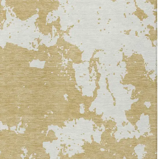 Gold And Ivory Abstract Washable Indoor Outdoor Area Rug Photo 6