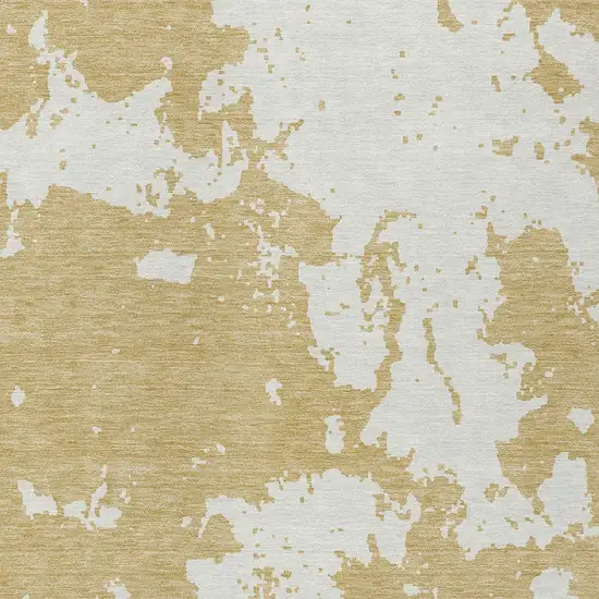 Gold And Ivory Abstract Washable Indoor Outdoor Area Rug Photo 6