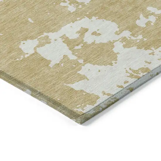 Gold And Ivory Abstract Washable Indoor Outdoor Area Rug Photo 5