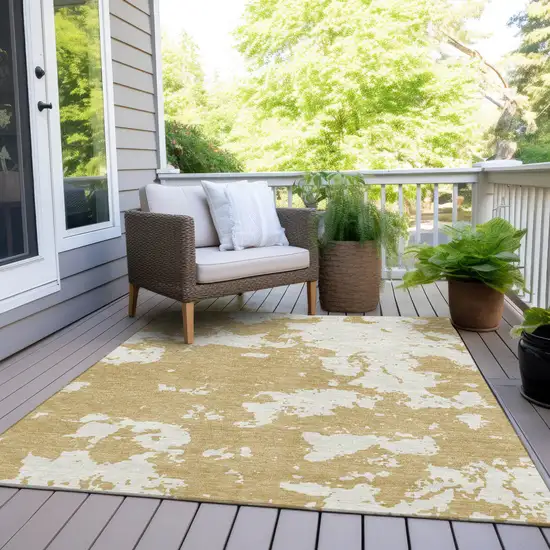 Gold And Ivory Abstract Washable Indoor Outdoor Area Rug Photo 8