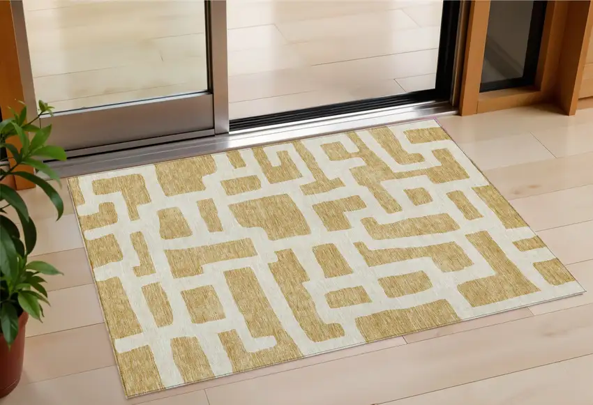 Gold And Ivory Abstract Washable Indoor Outdoor Area Rug Photo 1