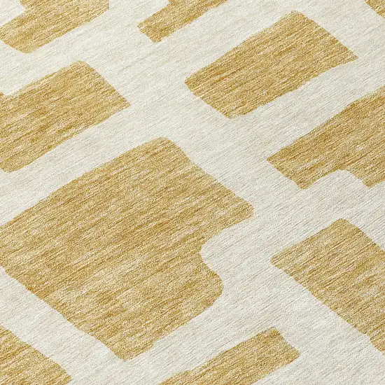 Gold And Ivory Abstract Washable Indoor Outdoor Area Rug Photo 8