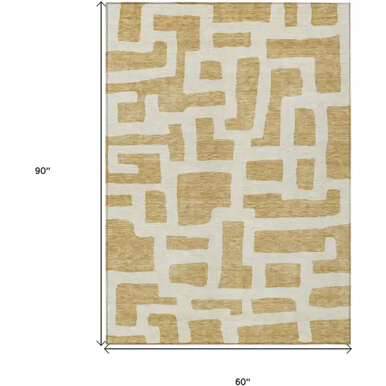 Gold And Ivory Abstract Washable Indoor Outdoor Area Rug Photo 7