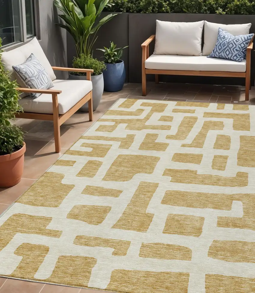 Gold And Ivory Abstract Washable Indoor Outdoor Area Rug Photo 1