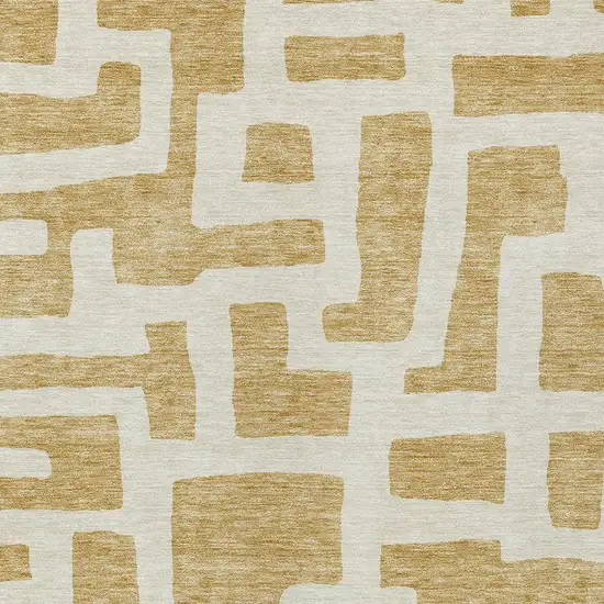 Gold And Ivory Abstract Washable Indoor Outdoor Area Rug Photo 6
