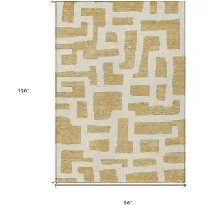 Photo of Gold And Ivory Abstract Washable Indoor Outdoor Area Rug