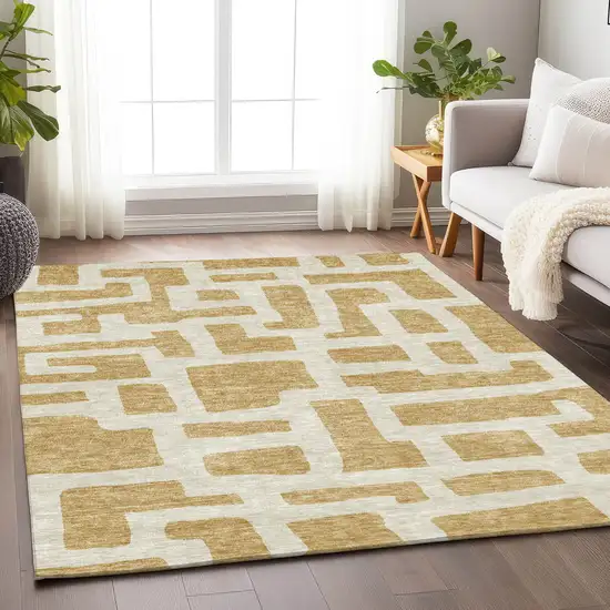 Gold And Ivory Abstract Washable Indoor Outdoor Area Rug Photo 9