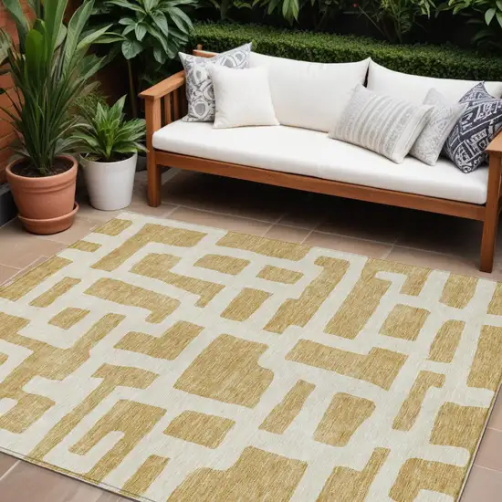 Gold And Ivory Abstract Washable Indoor Outdoor Area Rug Photo 1