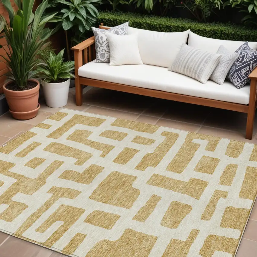 Gold And Ivory Abstract Washable Indoor Outdoor Area Rug Photo 1