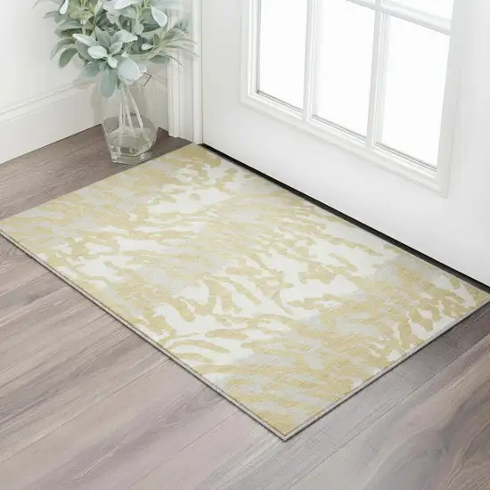 Gold And Ivory Animal Print Washable Area Rug With UV Protection Photo 2