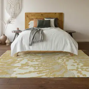 Photo of Gold And Ivory Animal Print Washable Area Rug With UV Protection