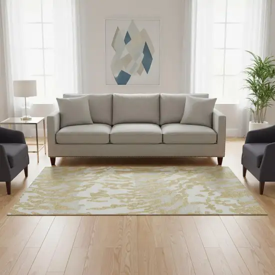 Gold And Ivory Animal Print Washable Area Rug With UV Protection Photo 2