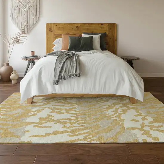 Gold And Ivory Animal Print Washable Area Rug With UV Protection Photo 5