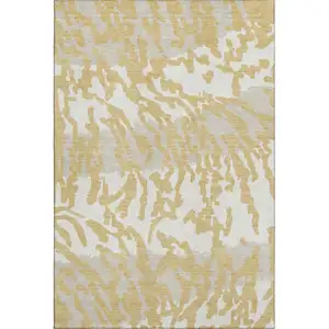 Photo of Gold And Ivory Animal Print Washable Area Rug With UV Protection