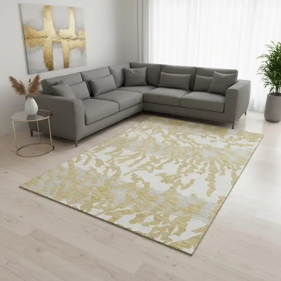 Gold And Ivory Animal Print Washable Area Rug With UV Protection Photo 2