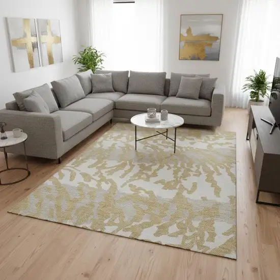 Gold And Ivory Animal Print Washable Area Rug With UV Protection Photo 2