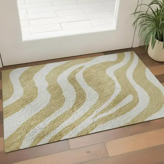 Gold And Ivory Animal Print Washable Area Rug With UV Protection Photo 2