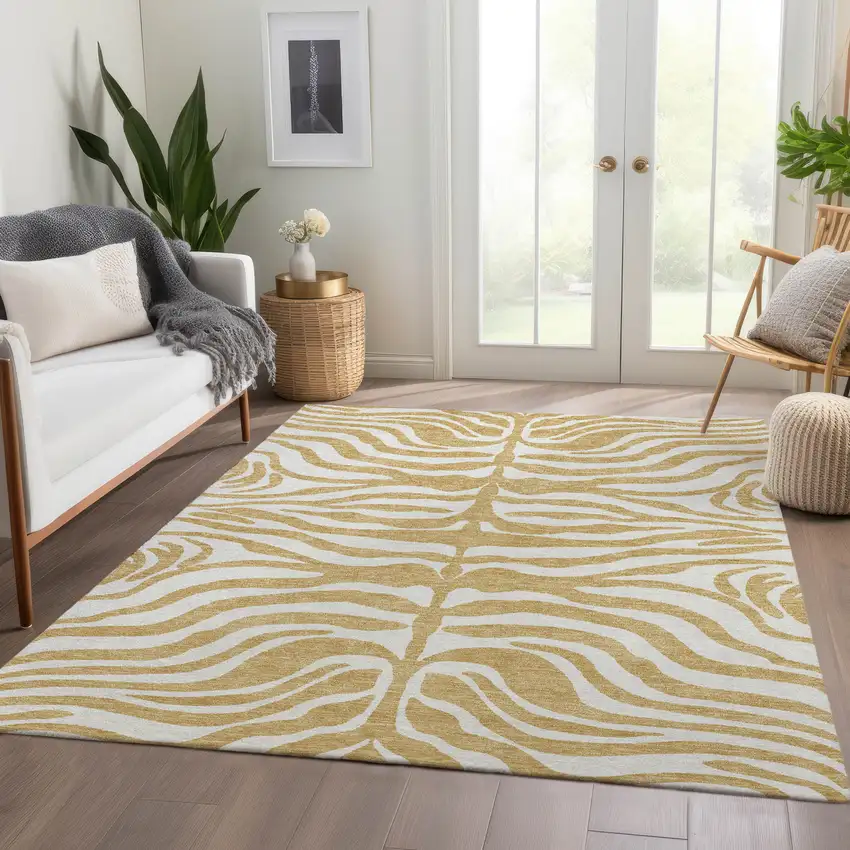 Gold And Ivory Animal Print Washable Area Rug With UV Protection Photo 4