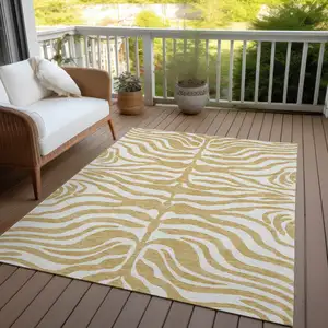 Photo of Gold And Ivory Animal Print Washable Indoor Outdoor Area Rug