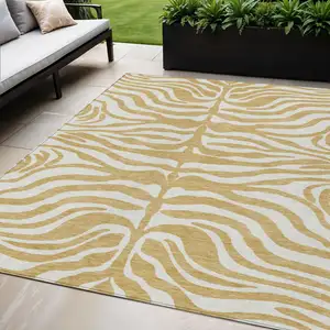 Photo of Gold And Ivory Animal Print Washable Indoor Outdoor Area Rug