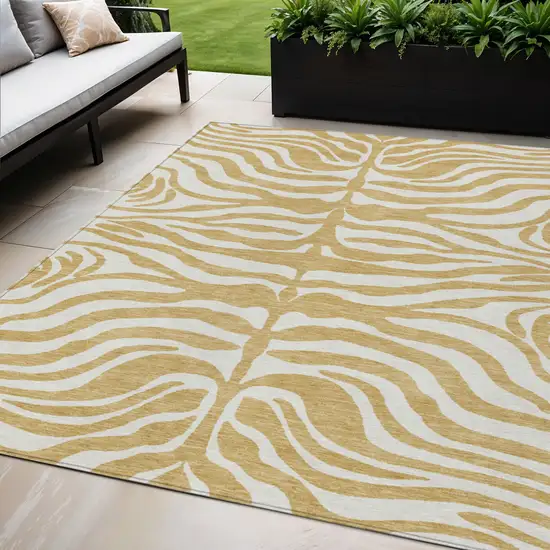 Gold And Ivory Animal Print Washable Indoor Outdoor Area Rug Photo 1