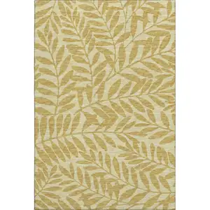 Photo of Gold And Ivory Botanical Leaves Washable Area Rug With UV Protection