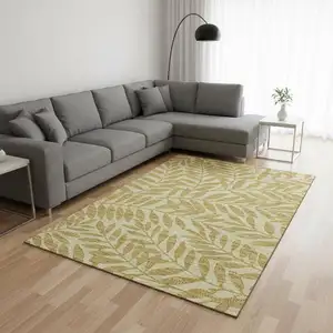 Photo of Gold And Ivory Botanical Leaves Washable Area Rug With UV Protection