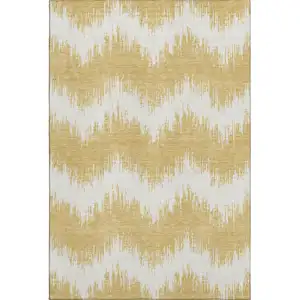 Photo of Gold And Ivory Chevron Washable Area Rug With UV Protection
