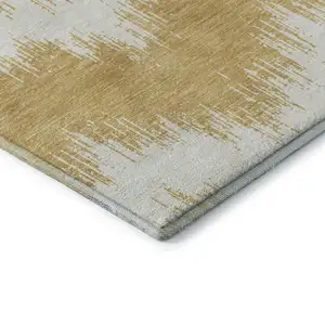 Photo of Gold And Ivory Chevron Washable Area Rug With UV Protection
