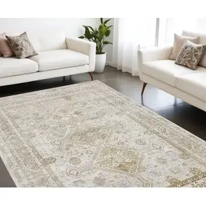 Photo of Gold And Ivory Floral Stain Resistant Area Rug