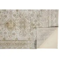 Photo of Gold And Ivory Floral Stain Resistant Area Rug