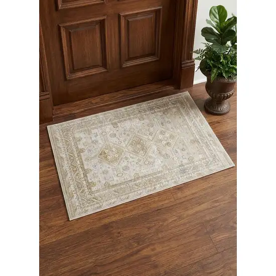 Gold And Ivory Floral Stain Resistant Area Rug Photo 1